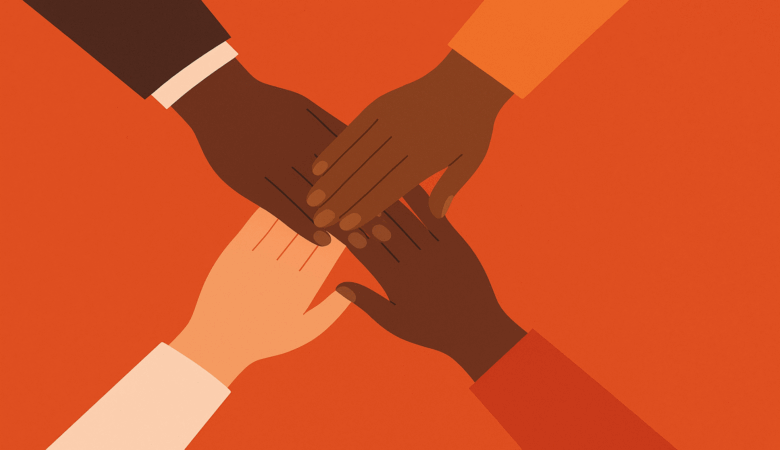 Diverse hands stacked together in a symbol of unity and cooperation.