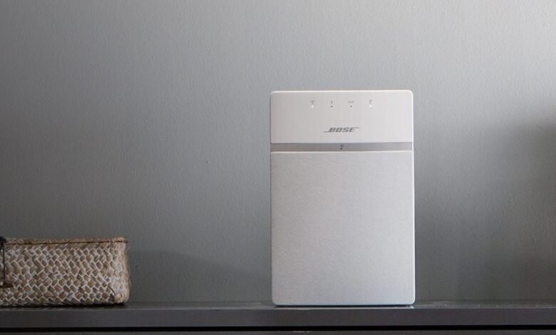 Bose smart speaker with Wi-Fi and Bluetooth connectivity on a shelf.