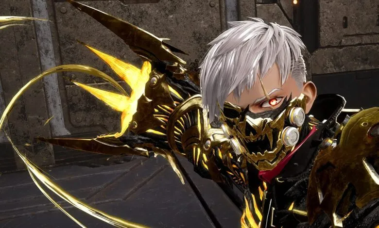 Close-up of a character with white hair, red eyes, and a golden mask, wearing ornate armor.