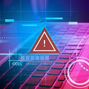Digital warning symbol with exclamation mark over a keyboard, indicating a system alert.