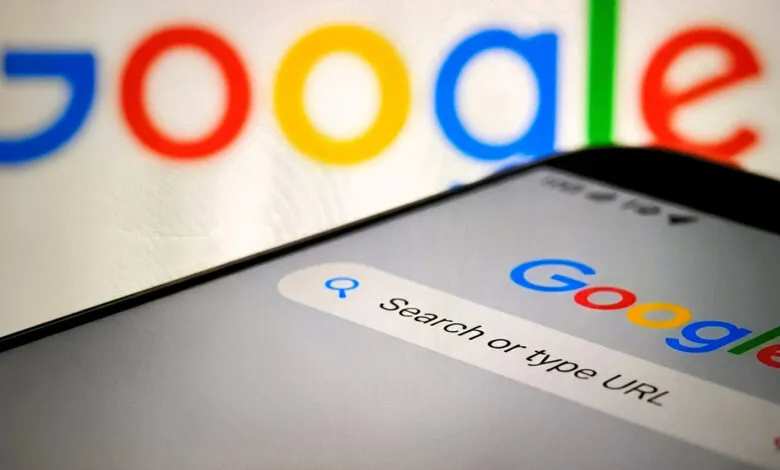 Close-up of a smartphone displaying the Google search bar and logo.
