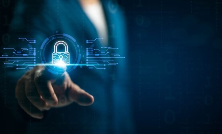 Person's hand touching a glowing digital padlock icon with circuit board elements.