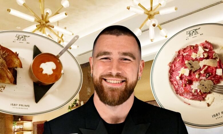 Man smiling with plates of food from 1587 Prime Steakhouse