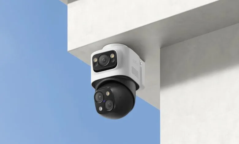 Eufy AI security camera mounted on a white building exterior.
