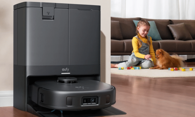 Eufy X10 Omni robot vacuum and charging station next to a child and dog playing