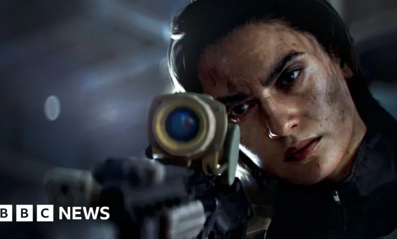Close-up of a determined woman aiming a sniper rifle, with dirt on her face.