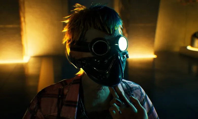 Close-up of a person wearing a futuristic mask and goggles, with colorful hair.