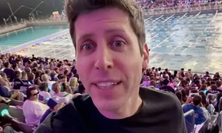 Man with surprised expression in foreground, crowd and swimming pool in background