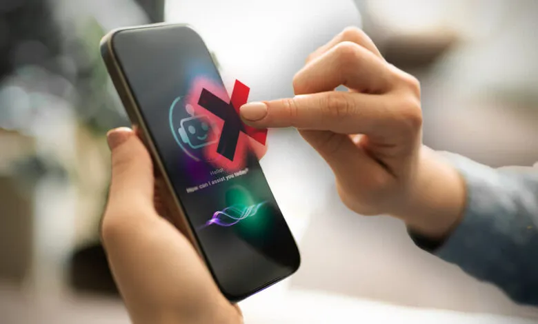 Person's finger tapping a red 'X' over a chatbot icon on a smartphone screen.