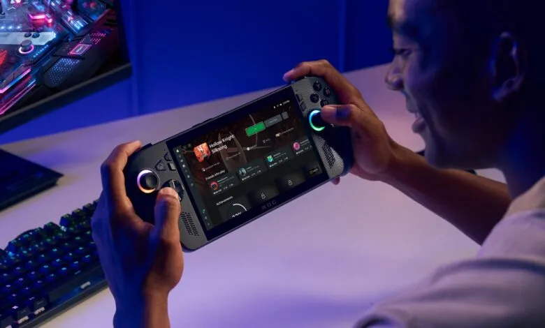 Person playing Hollow Knight: Silksong on a handheld gaming device with RGB lighting.