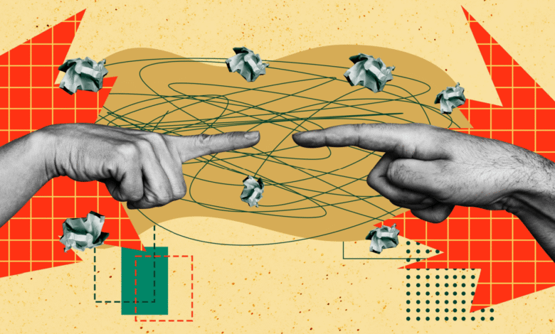 Two hands pointing fingers at each other with crumpled paper balls floating around.