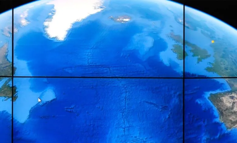 A digital map displays the Earth's oceans with detailed bathymetry and landmasses.