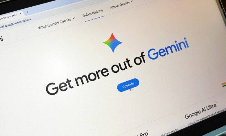 Close-up of a laptop screen showing the Gemini AI subscription page with an 'Upgrade' button.