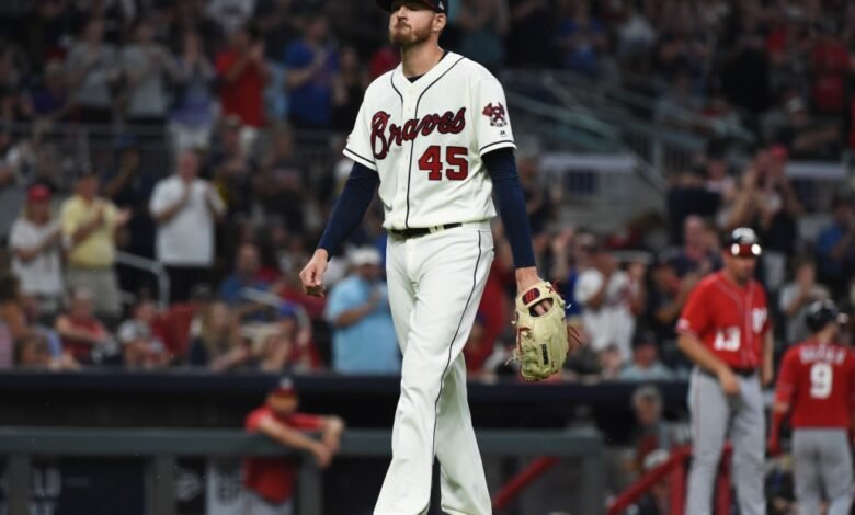 Atlanta Braves pitcher walking off the field during a baseball game.