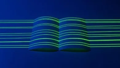 Abstract image of a book with glowing neon green lines on a dark blue background.
