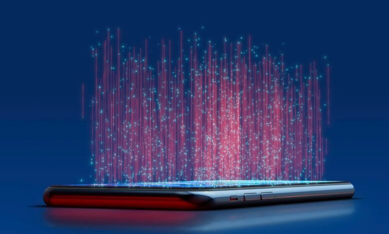 Smartphone emitting streams of red and blue digital data into the air.