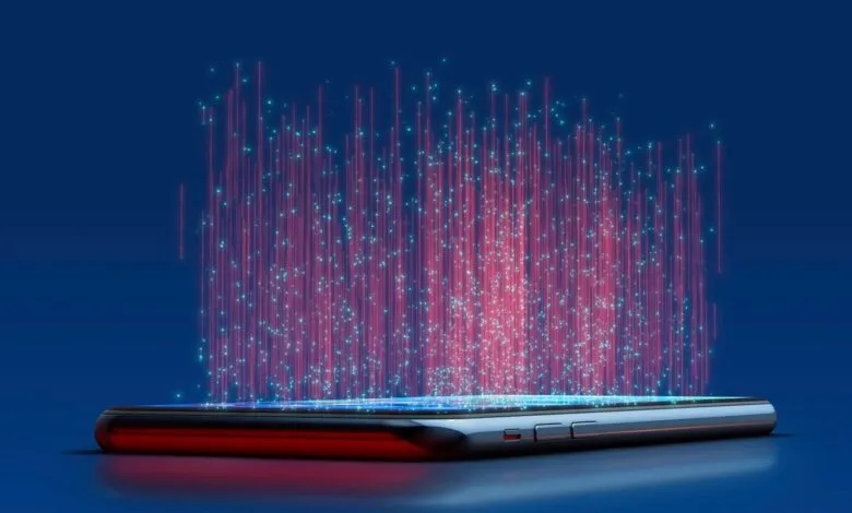 Smartphone emitting streams of red and blue digital data into the air.