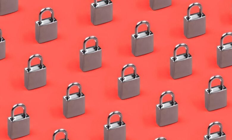 A repeating pattern of silver padlocks on a vibrant coral background.