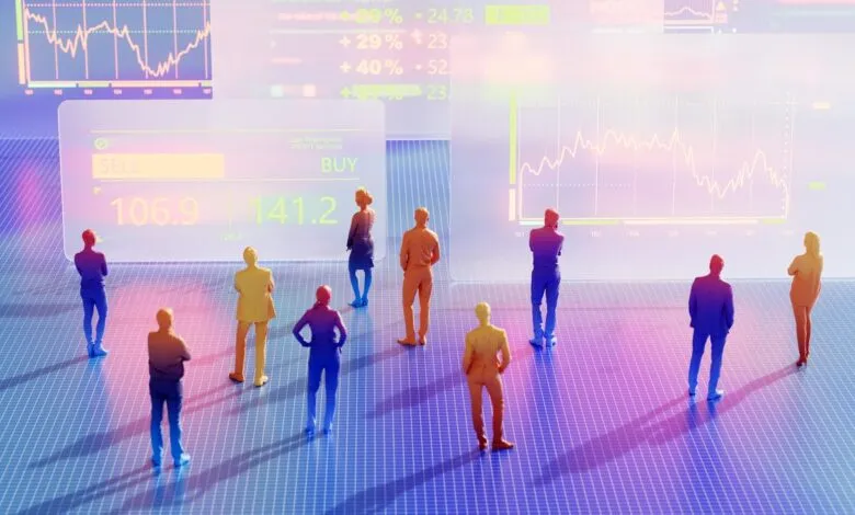 Miniature figures of people stand before a digital stock market display with graphs and buy/sell indicators.