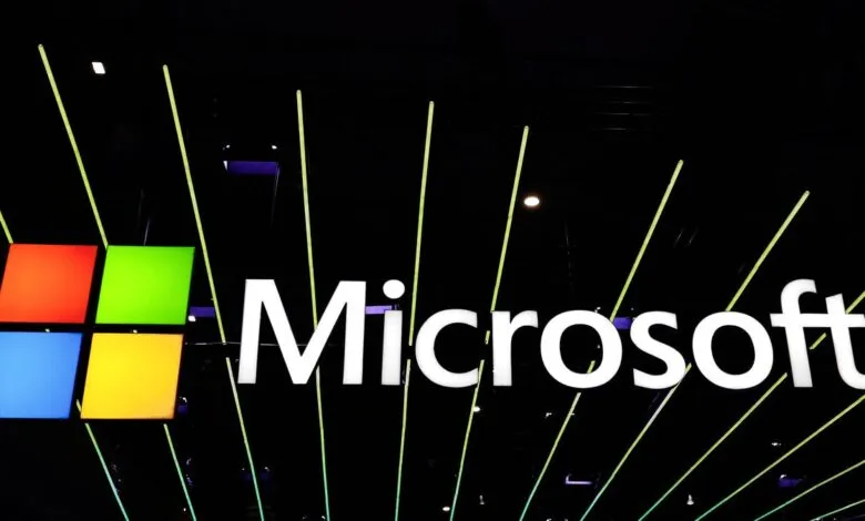 Microsoft logo with four colored squares and white text on a dark background.