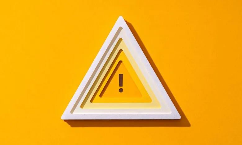 Layered warning triangle symbol with an exclamation mark on a bright yellow background.