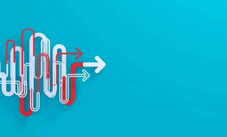 Abstract graphic of red and white arrows forming a maze-like path on a teal background.