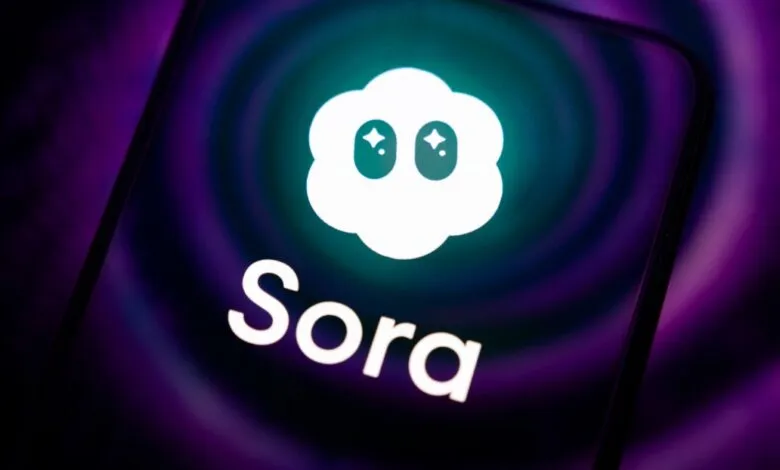 Close-up of the Sora app logo on a smartphone screen with a purple and teal gradient background.