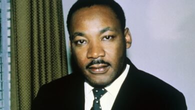 Close-up portrait of Dr. Martin Luther King Jr. in a suit and tie.