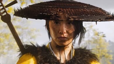 Close-up of a determined woman in traditional Japanese attire and a conical hat.