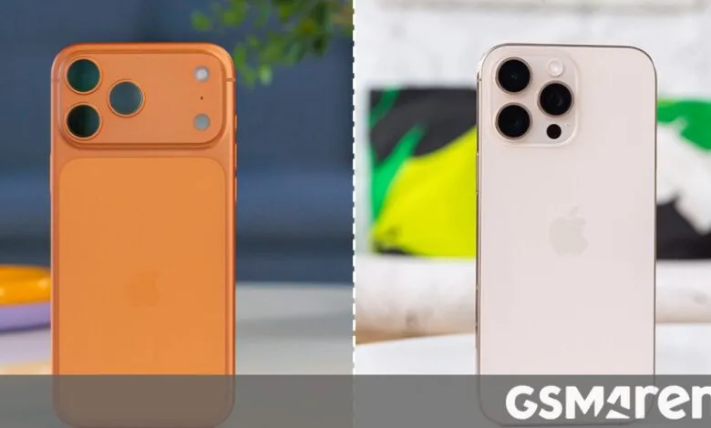 Side-by-side comparison of two iPhones: one orange, one pale pink, showcasing their rear camera modules.