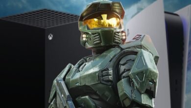 Master Chief from Halo stands between an Xbox Series X and a PlayStation 5 console.