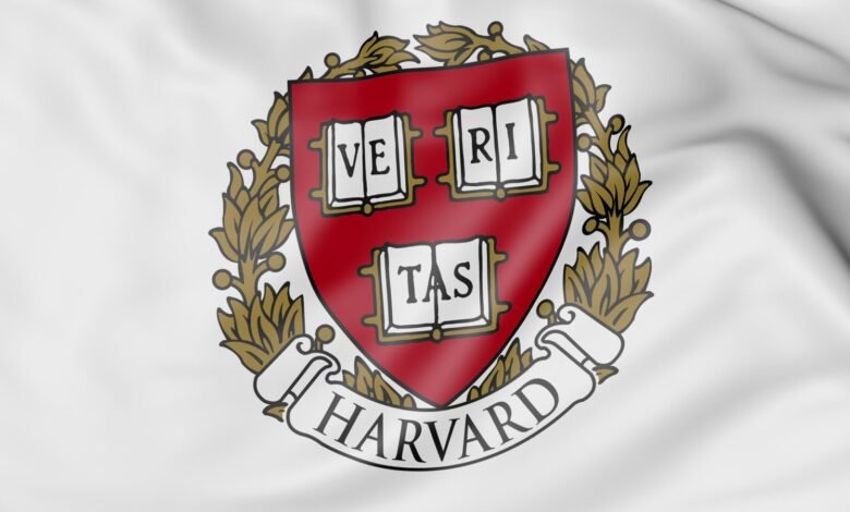 The Harvard University crest on a white, waving flag.