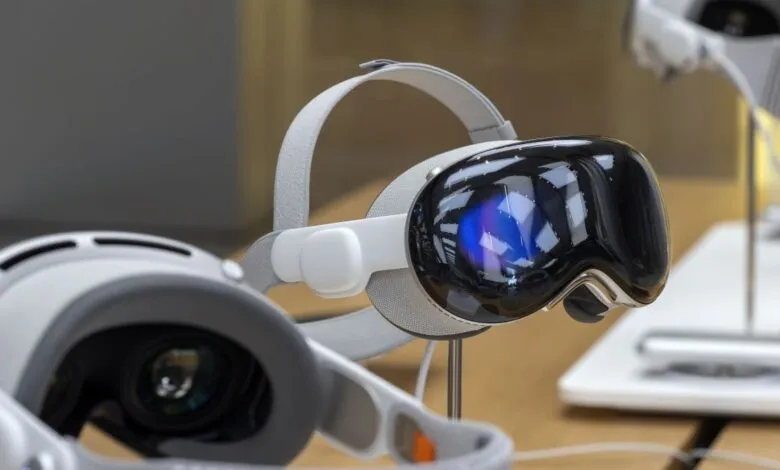 Close-up of a sleek, white virtual reality headset with a reflective black visor.