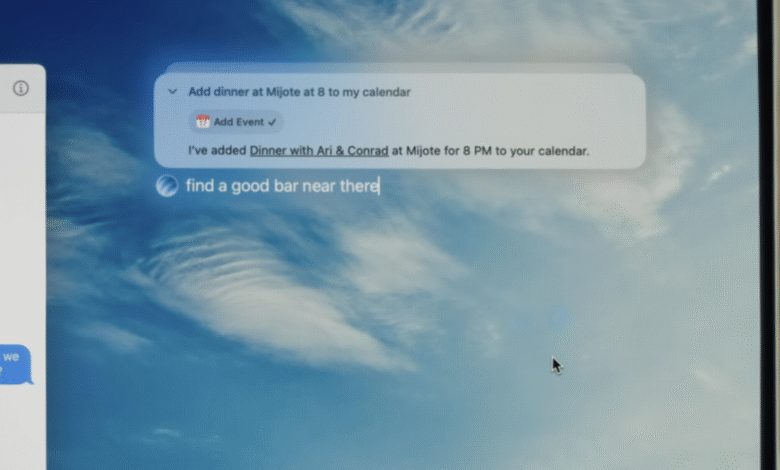 Close-up of a computer screen showing a digital assistant interface with a calendar event and a text message.