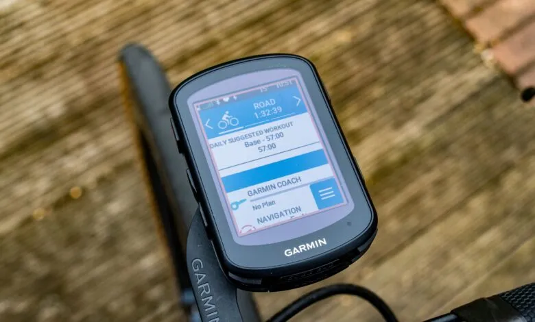 Close-up of a Garmin cycling computer displaying daily suggested workout and navigation options.