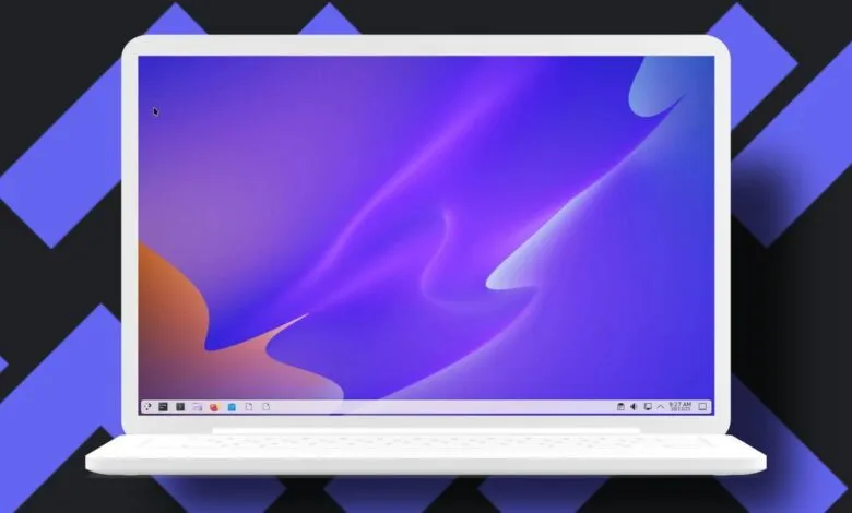 A white laptop displaying a vibrant purple and orange abstract wallpaper.