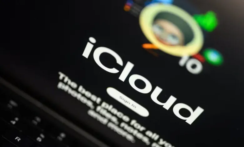 Close-up of the iCloud login screen on a laptop, showing the logo and tagline.