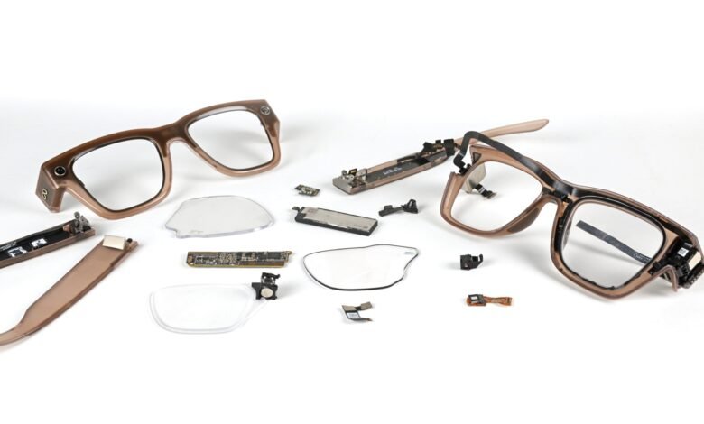 Disassembled smart glasses showing frames, lenses, battery, and circuit boards.