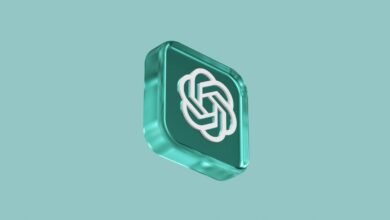 3D render of the OpenAI logo in a teal glass-like cube against a teal background.