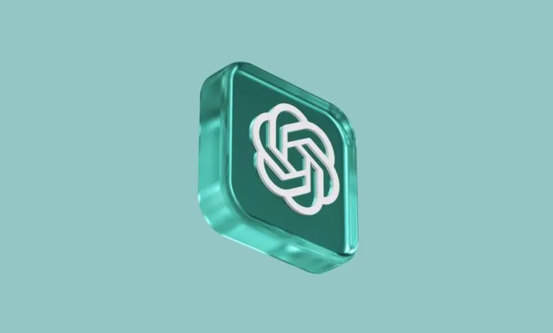 3D render of the OpenAI logo in a teal glass-like cube against a teal background.