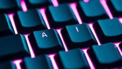 Close-up of a keyboard with illuminated keys, showing the letters 'A' and 'I'.