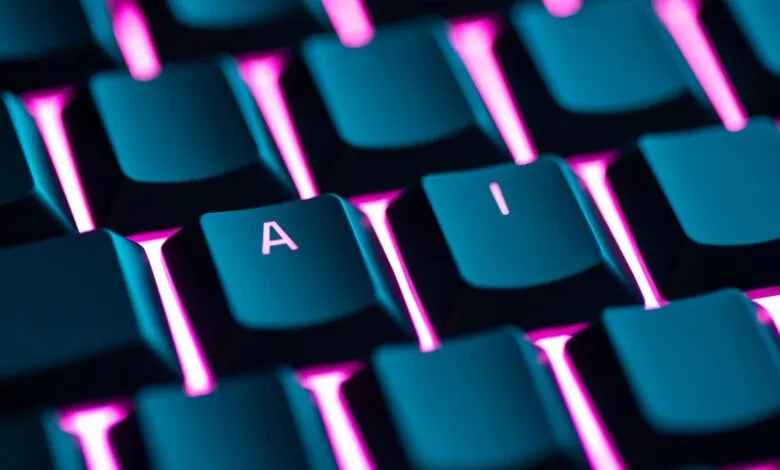 Close-up of a keyboard with illuminated keys, showing the letters 'A' and 'I'.