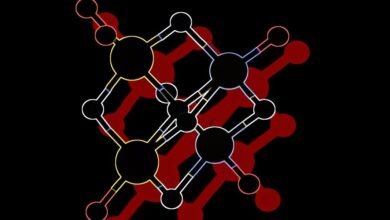 Abstract molecular structure with interconnected nodes and lines in various colors against a black background.