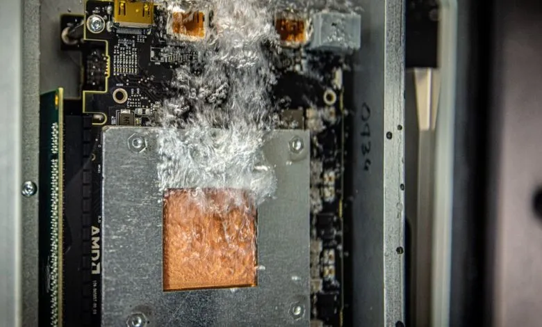 Close-up of a computer's internal components with liquid cooling system active.