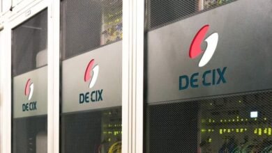 DE-CIX logo on server racks in a data center.