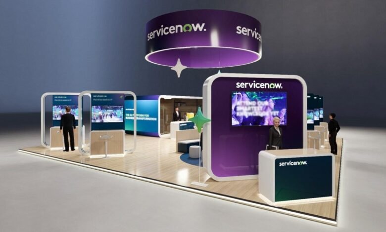 ServiceNow exhibition booth with digital displays and staff.