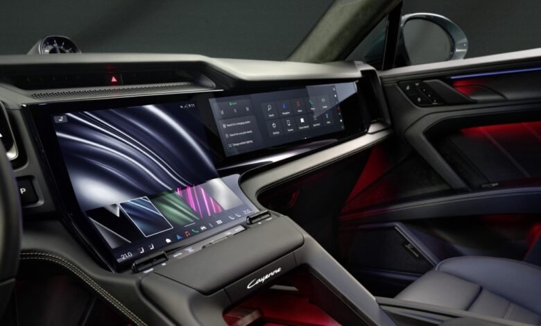 Modern car interior with multiple digital displays and ambient lighting.