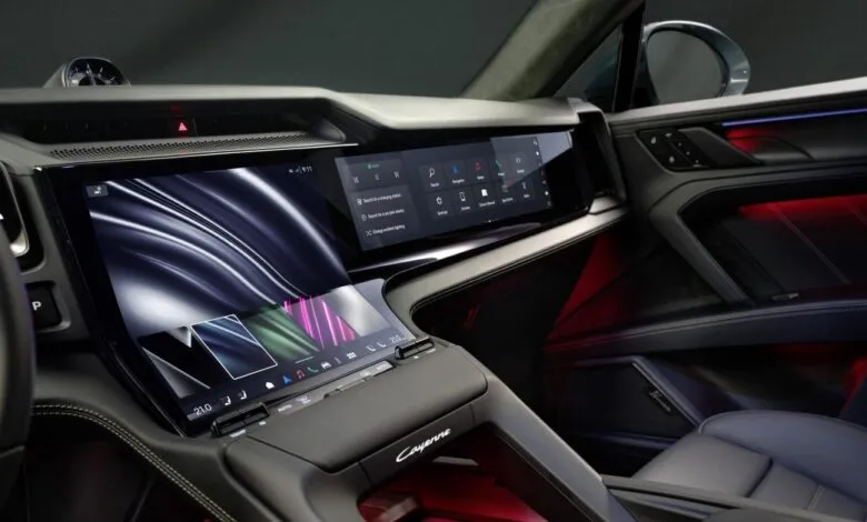 Modern car interior with multiple digital displays and ambient lighting.