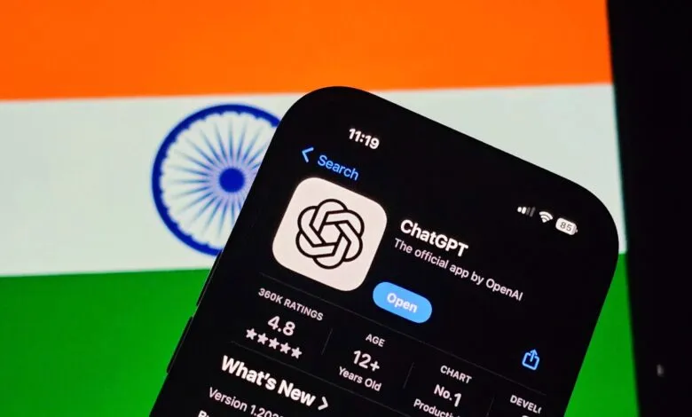 Smartphone displaying the ChatGPT app interface against the backdrop of the Indian flag.
