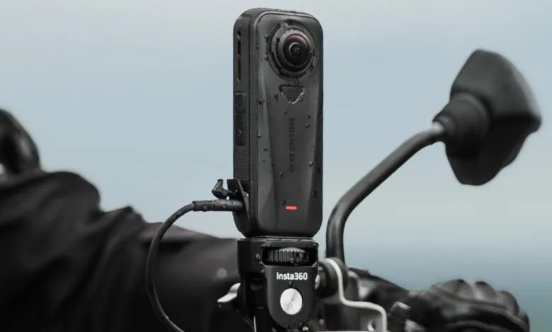 Insta360 X4 Air action camera mounted on a motorcycle handlebar.